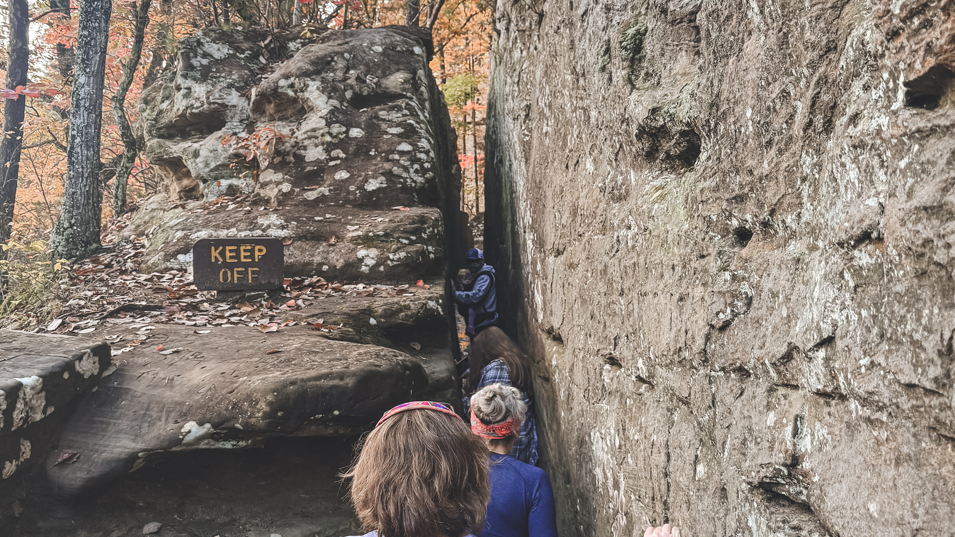 A tight pathway between enormous boulders.
